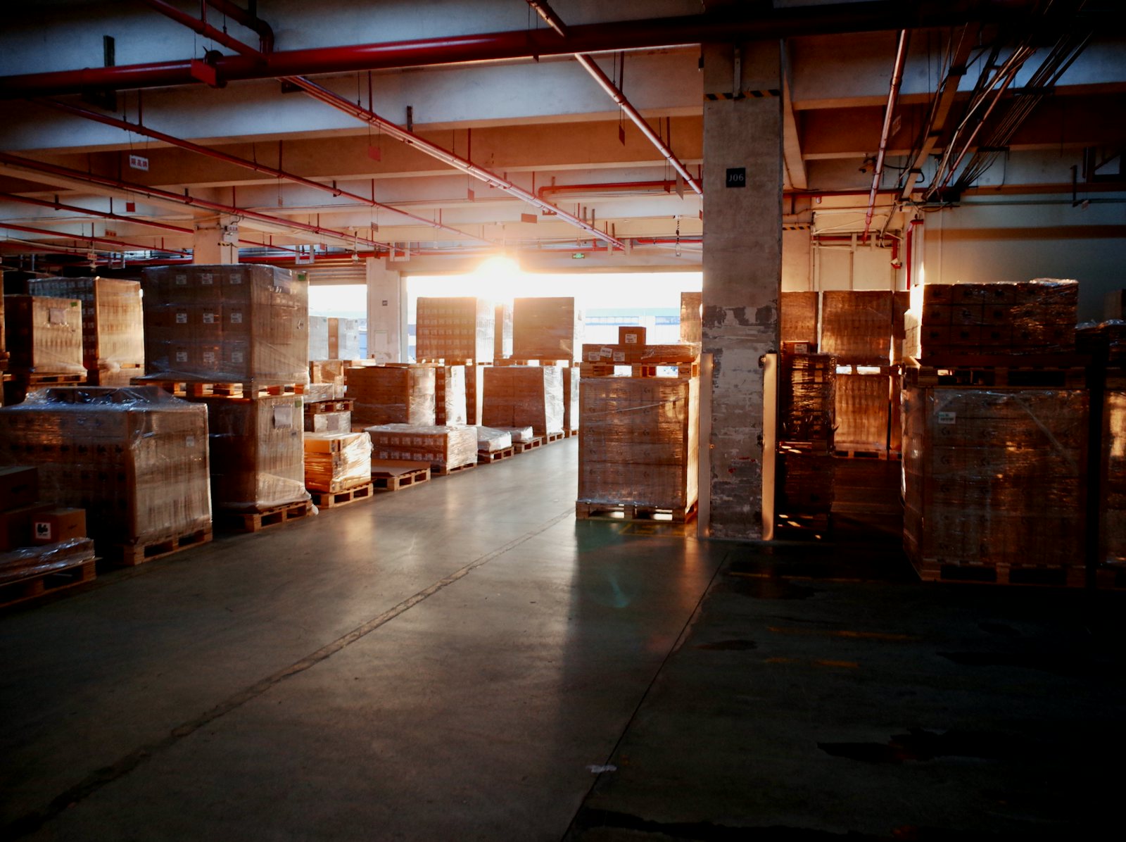 A warehouse stocked with pallets of goods ready to ship